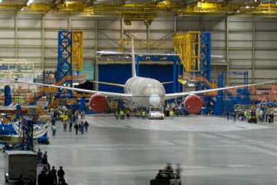 A 787 Dreamliner comes out of Boeing's Everett Assembly Line in Everett, Wash. , on June 25. The plane was being taken to a nearby facility to be painted. Associated Press
(Associated Press / The Spokesman-Review)