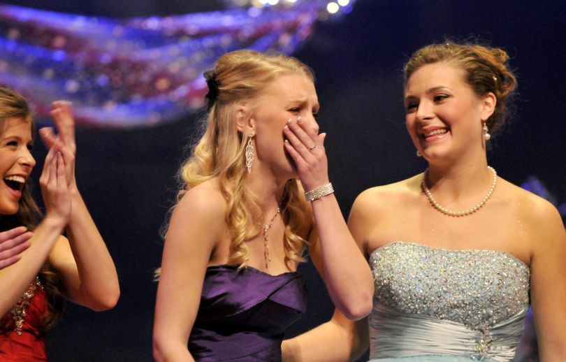 Brett Rountree is overcome with emotion as she is announced as the 2013 Lilac queen on Sunday at the Bing Crosby Theater. Emily Staker, left, and Katie Heitkemper, right, look on. (Jesse Tinsley)