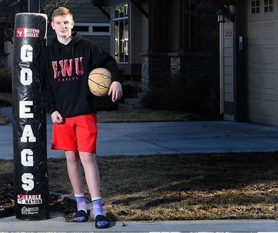 Salk Middle School student Dylynn Groves poses in front of his family’s home in Spokane earlier this month before his brothers – EWU basketball standouts Tanner and Jacob Groves – played in the NCAA Tournament. 