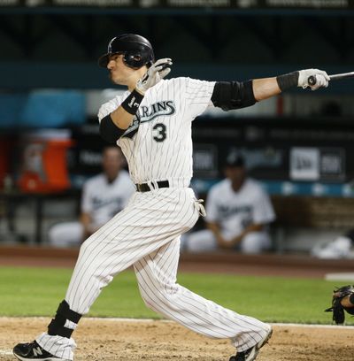 Florida Marlins' Jorge Cantu bats during the sixth inning of a baseball game against the Cincinnati Reds, Wednesday, April 14, 2010, in Miami. Cantu hit a home run in the fifth inning, making him the first player in major league history to have at least one hit and one RBI in each of his team's first nine games, and the Marlins defeated the Reds 5-3.  (Associated Press)