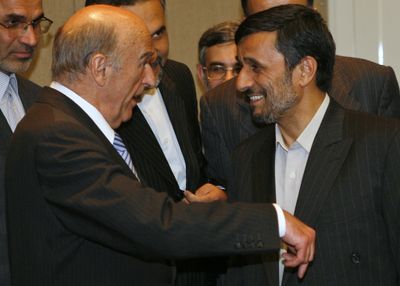 Iranian President Mahmoud Ahmadinejad, right, speaks with Swiss President Hans-Rudolf Merz shortly after arriving in Geneva, Switzerland, on Sunday.  (Associated Press / The Spokesman-Review)