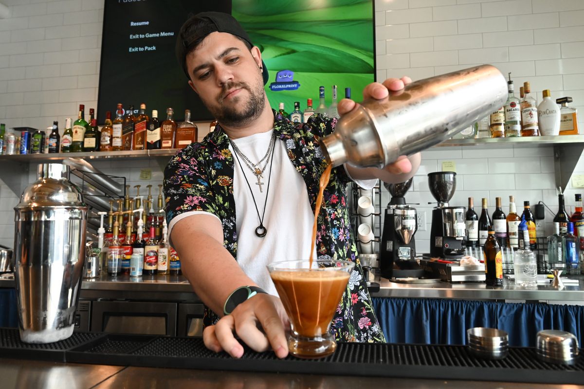 Bartender J-Dog pours an espresso martini at Bella’s Cafe and Cocktails on June 21 at the Catalyst Building in Spokane.  (Tyler Tjomsland/The Spokesman-Review)