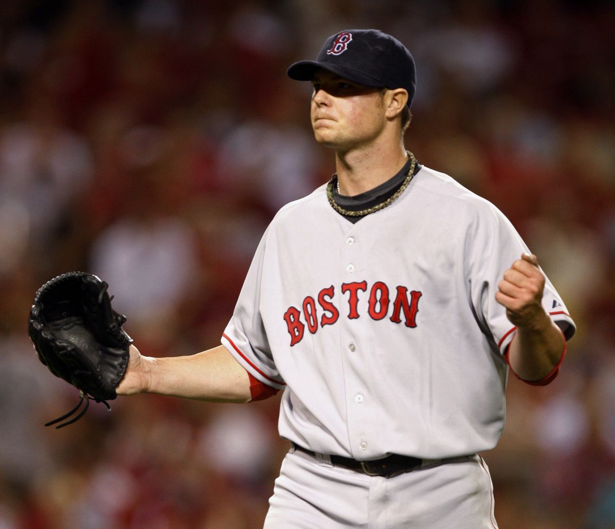 Boston starter Jon Lester allowed no earned runs in seven innings. (Associated Press / The Spokesman-Review)