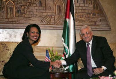 
U.S. Secretary of State Condoleezza Rice shakes hands Sunday with Palestinian President Mahmoud Abbas in Amman, Jordan. Associated Press
 (Associated Press / The Spokesman-Review)