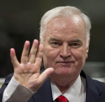 Bosnian Serb military chief Ratko Mladic waves as he enters the Yugoslav War Crimes Tribunal in The Hague, Netherlands, Wednesday, Nov. 22, 2017, to hear the verdict in his genocide trial. (Peter Dejong / Associated Press)