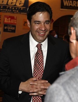 Idaho Republican candidate Raul Labrador talks with a supporter on Tuesday, May 25, 2010 at the Republican campaign headquarters in Boise, Idaho. Labrador was mingling in the room while awaiting his election results. (Matt Cilley / AP Photo)