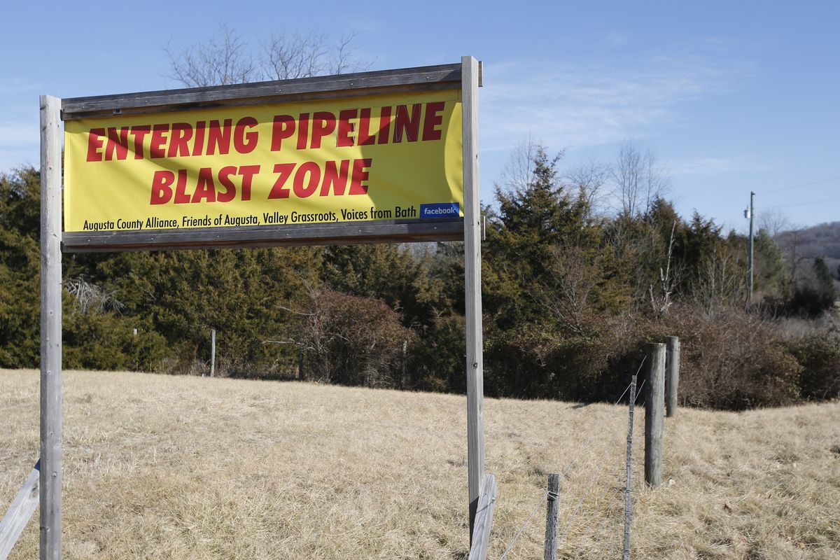 A sign along a highway protests the route of the Atlantic Coast Pipeline in Deerfield, Va.  (Steve Helber)