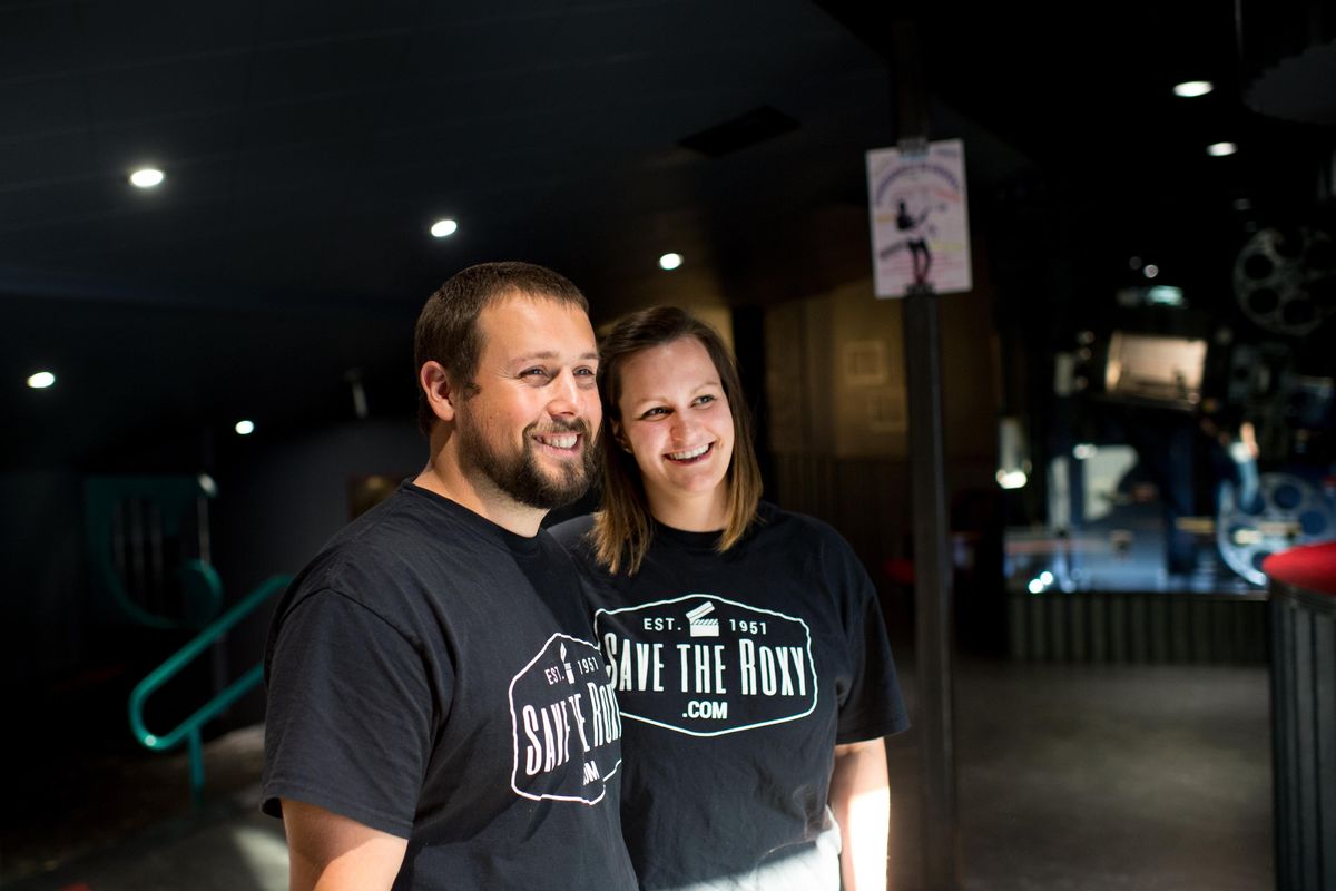 New Roxy owners Jason and Brittany Totland pose for a photo in the lobby of their theater on Wednesday, Aug. 16, 2017, in Newport, Wash. (Tyler Tjomsland / The Spokesman-Review)
