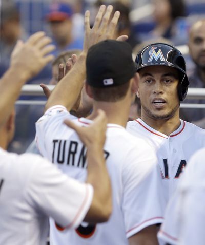 Giancarlo Stanton may consider Marlins Park a place for pitchers, but the Marlins average 5.7 runs per game there. (Associated Press)