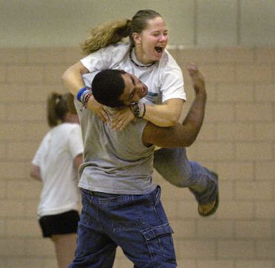 
Pedro Mendoza and Liz Sturgill give each other a hug hard enough to break a balloon lodged between them during a Link Crew training session at Shadle Park High School on Monday. The two will be mentors for incoming freshmen. 
 (Christopher Anderson/ / The Spokesman-Review)