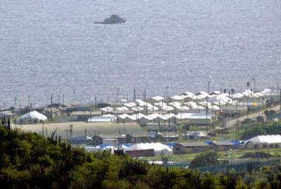 
A U.S. military boat patrols by Camp Delta in this  file photo of Guantanamo Bay, Cuba. 
 (Associated Press / The Spokesman-Review)