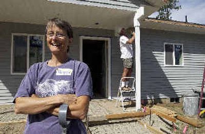 
Peggy Capes is getting the latest Habitat for Humanity house being built in Rathdrum. At right is Warren Fisher, a volunteer who also helped counsel Capes toward the new home. 
 (Jesse Tinsley / The Spokesman-Review)