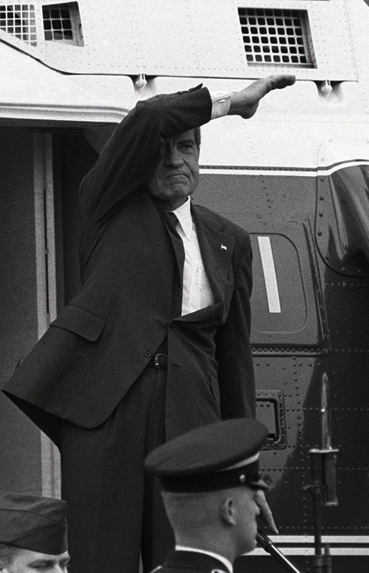 President Richard Nixon waves a final farewell from the steps of a helicopter as he leaves the White House for the last time after his resignation in this Aug. 9, 1974. (Associated Press)