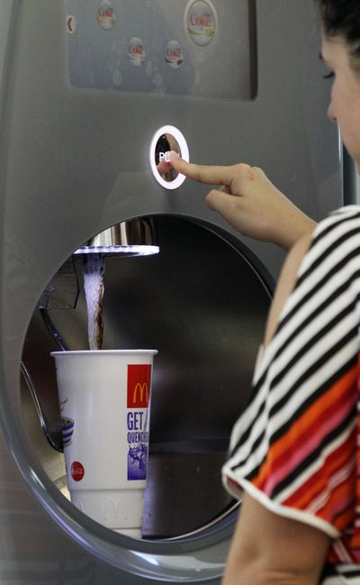 Christina Nunez fills up a supersized soft-drink cup with cola at a fast-food restaurant in New York on Thursday. (Associated Press)