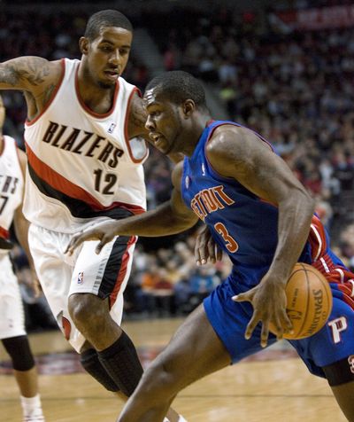 Detroit’s Rodney Stuckey drives on Portland’s LaMarcus Aldridge.  (Associated Press)