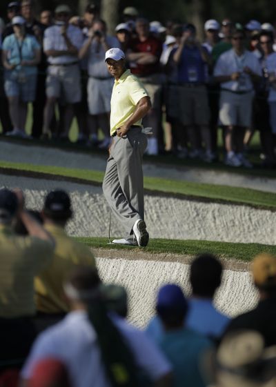 Tiger Woods will be paired with Matt Kuchar and K.J. Choi.  (Associated Press)