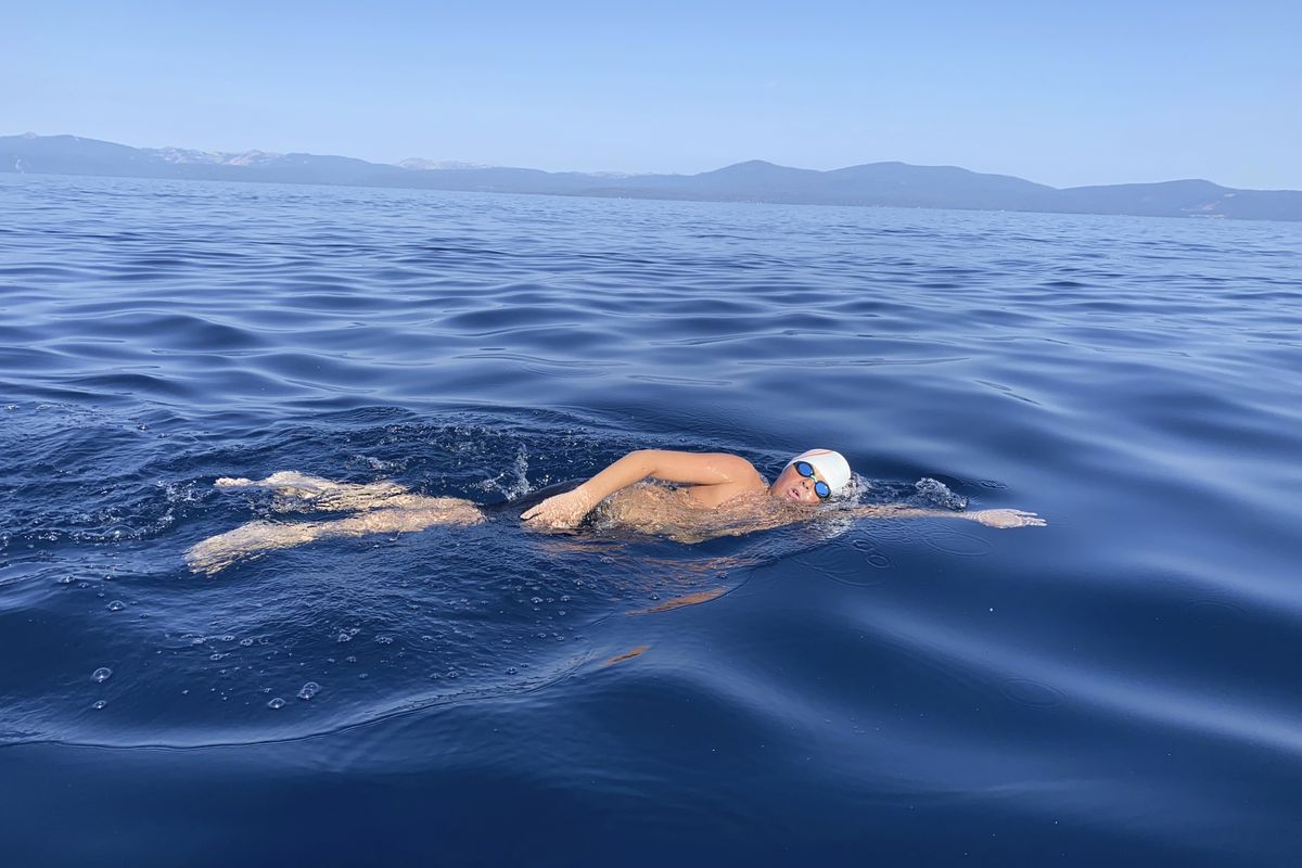 This Aug. 1, 2021 image provided by Jillian Savage shows James Savage, 14, of Los Banos, Calif. as he swam the entire 21.3-mile length of Lake Tahoe from South Lake Tahoe, California to Incline Village, Nevada. He became the youngest person ever to make the swim and complete the coveted Tahoe Triple Crown. He completed the two other legs of the triple crown earlier, each 10 miles are longer.  (Jillian Savage)