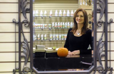Amber Doyle stands in her new store, Pure Beauty, at the Spokane Valley Mall. She sells natural and organic beauty products, and plans to open the store Friday. (Jesse Tinsley / The Spokesman-Review)