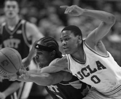 
Pittsburgh's Levance Fields, left, and UCLA's Russell Westbrook, vie for the ball in the first half of Thursday's game. 
 (The Spokesman-Review)