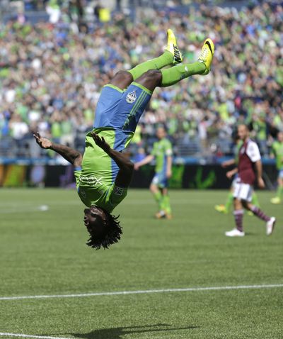 Obafemi Martins throws celebratory backflip after scoring Seattle’s fourth goal. (Associated Press)