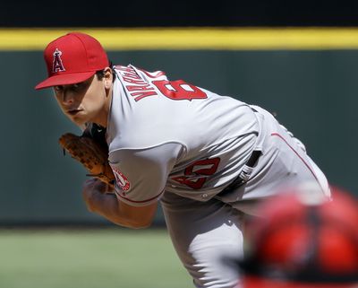 Jason Vargas recorded a win for the Angels over the M’s. (Associated Press)