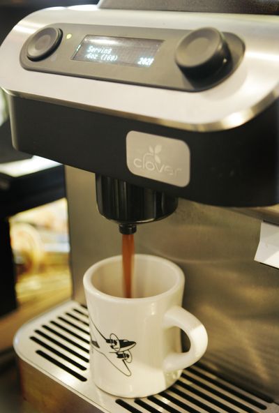 To brew in the Clover system, a barista grinds coffee beans by the cup, then pours them into the brew chamber. The machine sends in a blast of hot water before a piston lifts and pushes down a filter, sending the coffee out through a dispenser. (Associated Press / The Spokesman-Review)