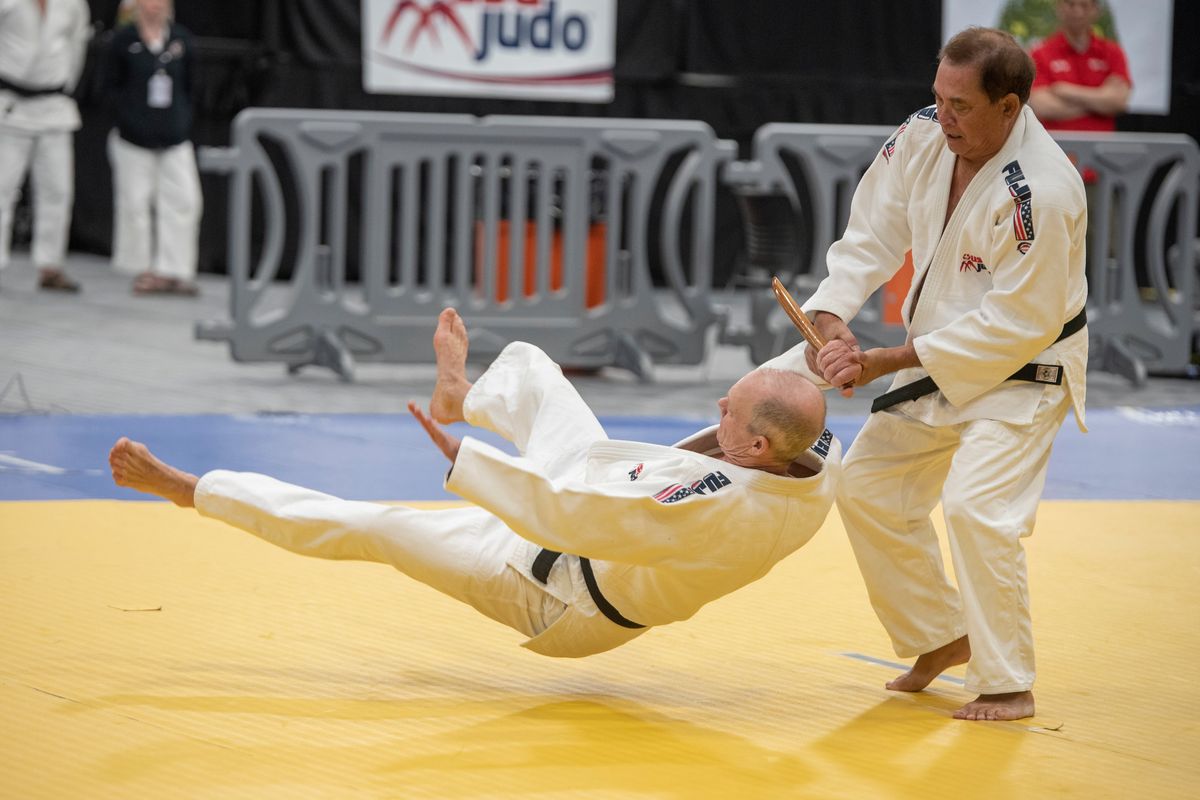 Judo teacher Ron Takeya, right, demonstrates a self-defense technique that is part of the goshin jutsu kata against his teammate Stephen Hall on Sunday at the Podium in Spokane. Takeya and Hall traveled from Hawaii to compete.  (Jesse Tinsley/THE SPOKESMAN-REVIEW)