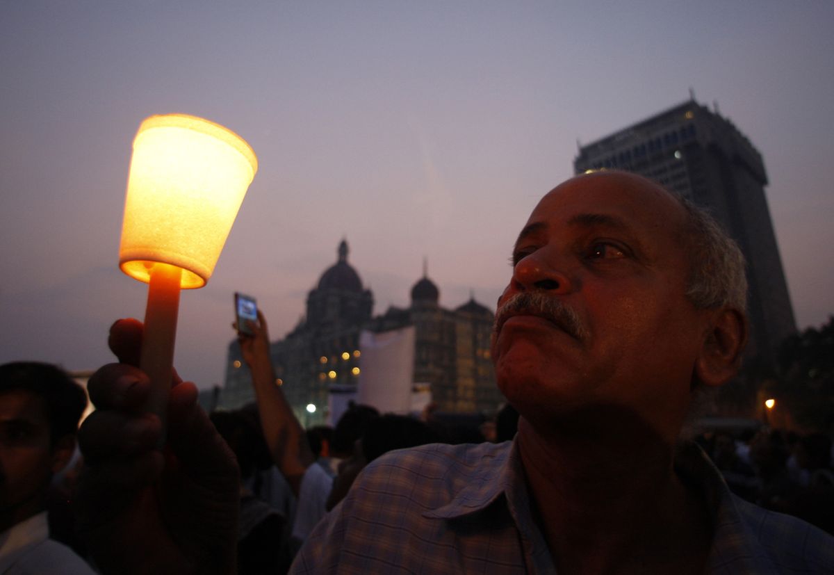 Hundreds lit candles in memory of people killed in the terror attacks outside the Taj Mahal hotel in Mumbai, India, on Wednesday.Associated Press photos (Associated Press photos / The Spokesman-Review)
