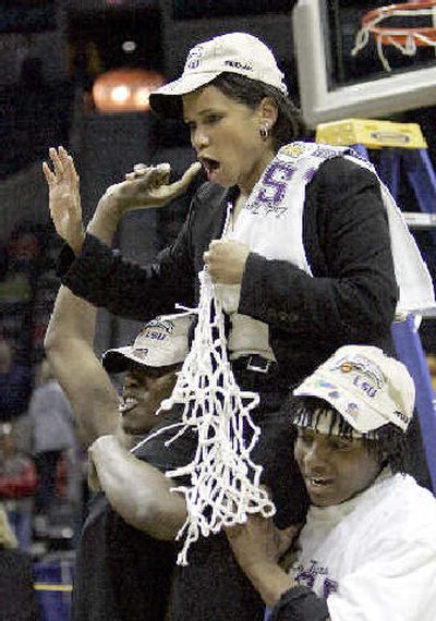 
LSU players carry coach Pokey Chatman after the Tigers' Monday win over Stanford. 
 (Associated Press / The Spokesman-Review)