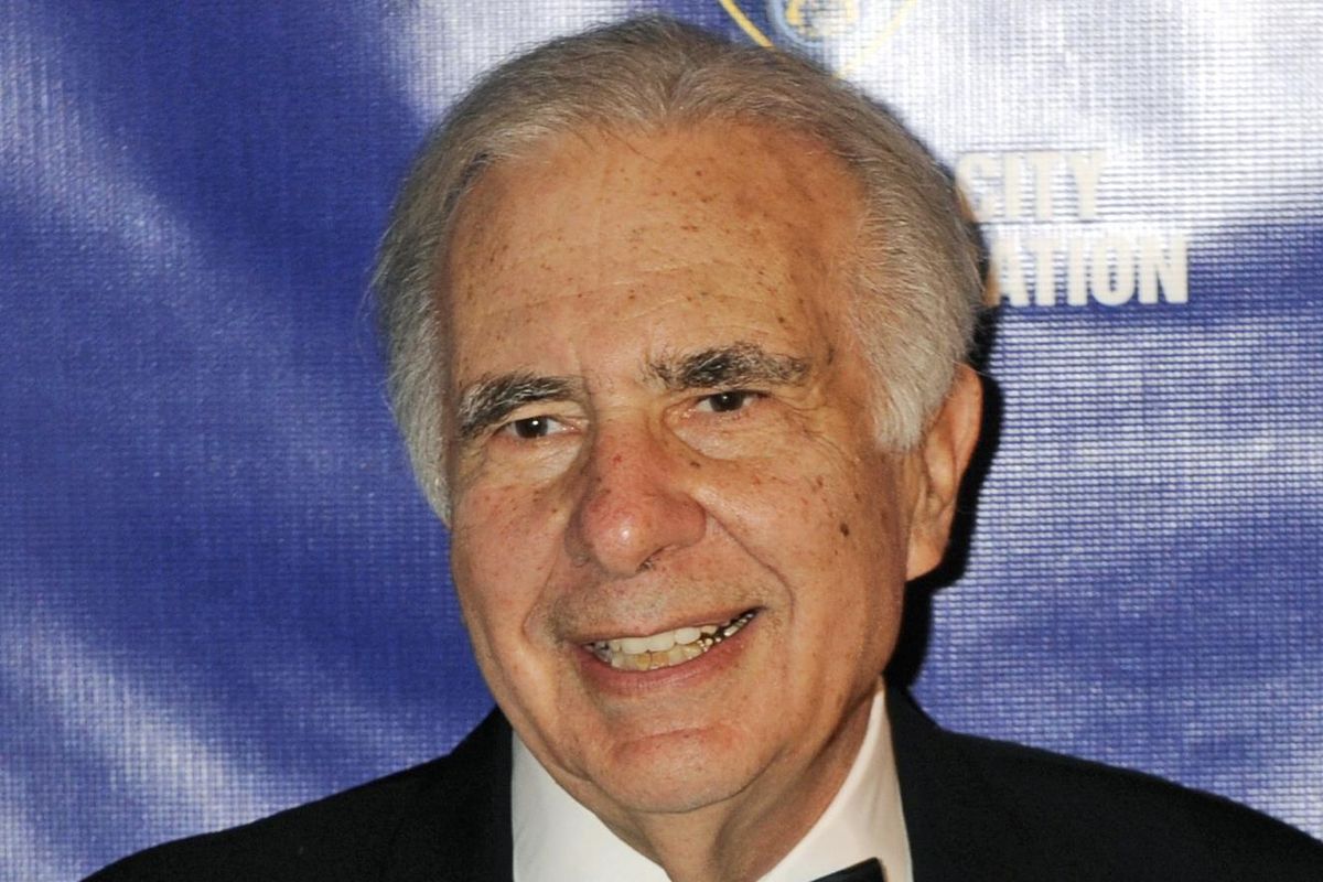 Financier Carl Icahn poses for photos March 16, 2016, upon arriving for the annual New York City Police Foundation Gala in New York. The Trump Taj Mahal, owned by Icahn, said Wednesday, Aug. 4, the resort casino would shut down after Labor Day, which would eliminate 3,000 jobs. (Henny Ray Abrams / Associated Press)