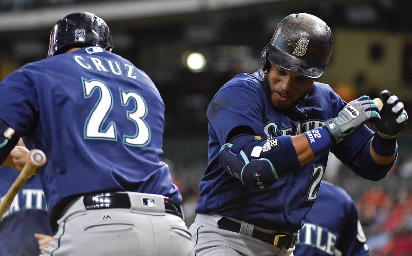 Seattle’s Robinson Cano, right, celebrates his three-run home run off Houston Astros starting pitcher Doug Fister with Nelson Cruz in the first inning  Wednesday  in Houston. (Eric Christian Smith / Associated Press)