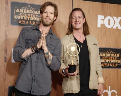 Tyler Hubbard, left, and Brian Kelley of Florida Georgia Line pose award for artist of the year in the press room at the 2016 American Country Countdown Awards at the Forum on Sunday, May 1, 2016 in Inglewood, Calif. (Danny Moloshok / Invision/AP)