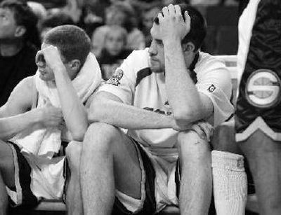 
 Seattle SuperSonics' Luke Ridnour, left, and Nick Collison sit on the bench. 
 (Associated Press / The Spokesman-Review)
