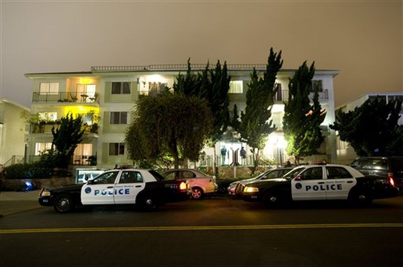 Police and FBI surround the apartment building in Santa Monica, Calif., where fugitive crime boss James 