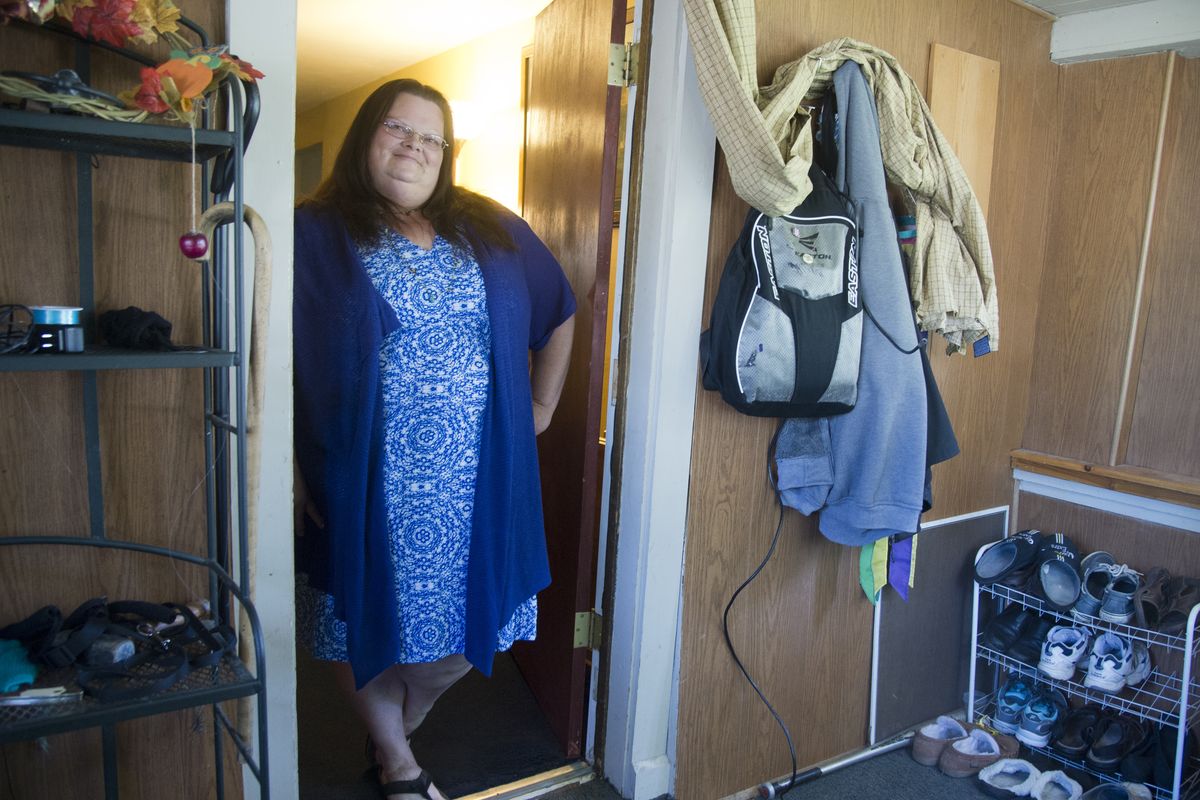 Pattie Kappen, photographed in her home June 12, finally quit smoking last year, kicking a nearly 20-year habit. She has dropped nearly 40 pounds in preparation for gastric bypass surgery. To celebrate her accomplishments so far, she bought her first dress. (Jesse Tinsley)