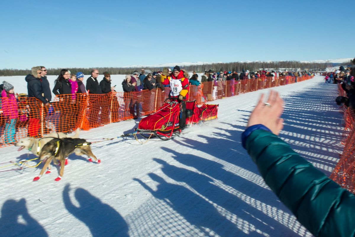Iditarod Trail Sled Dog Race musher Mitch Seavey begins his race to Nome amongst a crowd of spectators Sunday, March 6, 2016 in Willow, Alaska. (AP)