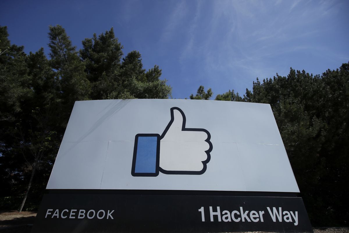 The thumbs-up like logo is shown on a sign at Facebook headquarters in Menlo Park, Calif., on April 14.  (Jeff Chiu/Associated Press)