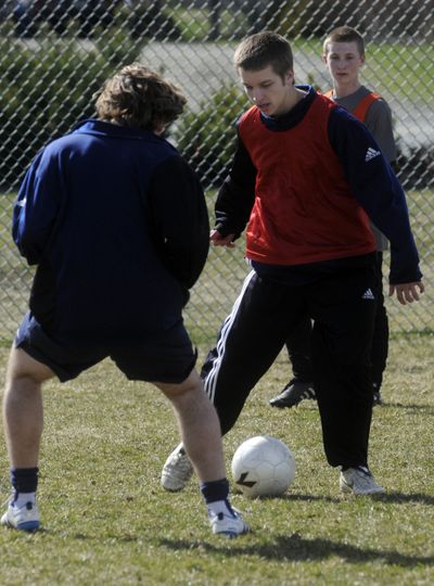 Joseph Guerrinha, center, practices with his teammates after taking a monthlong break from soccer to recover from a concussion.