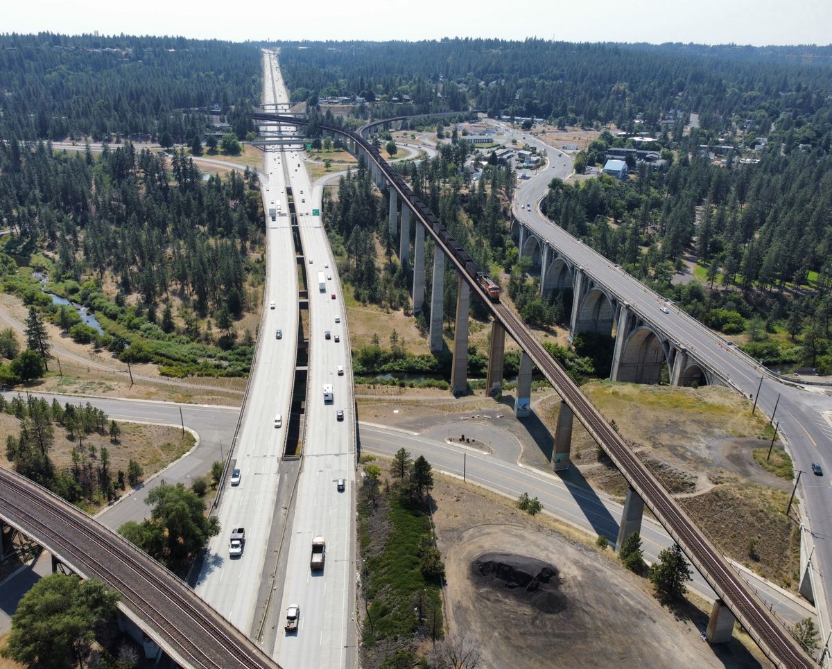 2024: Interstate 90, completed in the 1970s, took much of the traffic off the Sunset Highway, at far right, and connected Spokane to east and west regions with high-speed traffic. The railroad viaduct, in the center right, was completed in 1972 to remove the trains from Riverfront Park in time for Expo '74.  (Jesse Tinsley/THE SPOKESMAN-REVIEW)