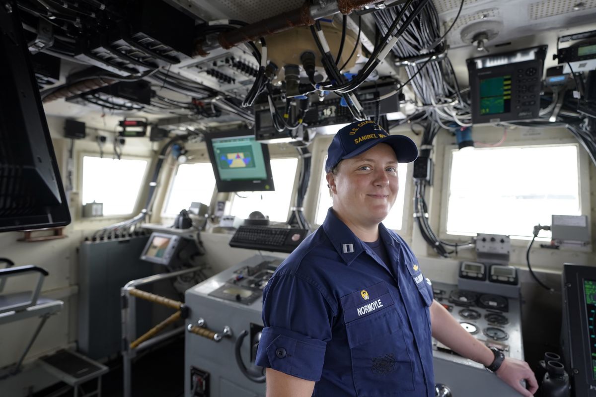 U.S. Coast Guard Lt. Kelli Normoyle, Commanding Officer of the Coast Guard Cutter Sanibel, stands for a photograph on the bridge of the vessel, Thursday, Sept. 16, 2021, at a shipyard in North Kingstown, R.I. Normoyle was one of two cadets who formally started the process to create the CGA Spectrum Diversity Council just a few months after the law known as "don't ask, don't tell" was repealed on Sept. 20, 2011.  (Steven Senne)