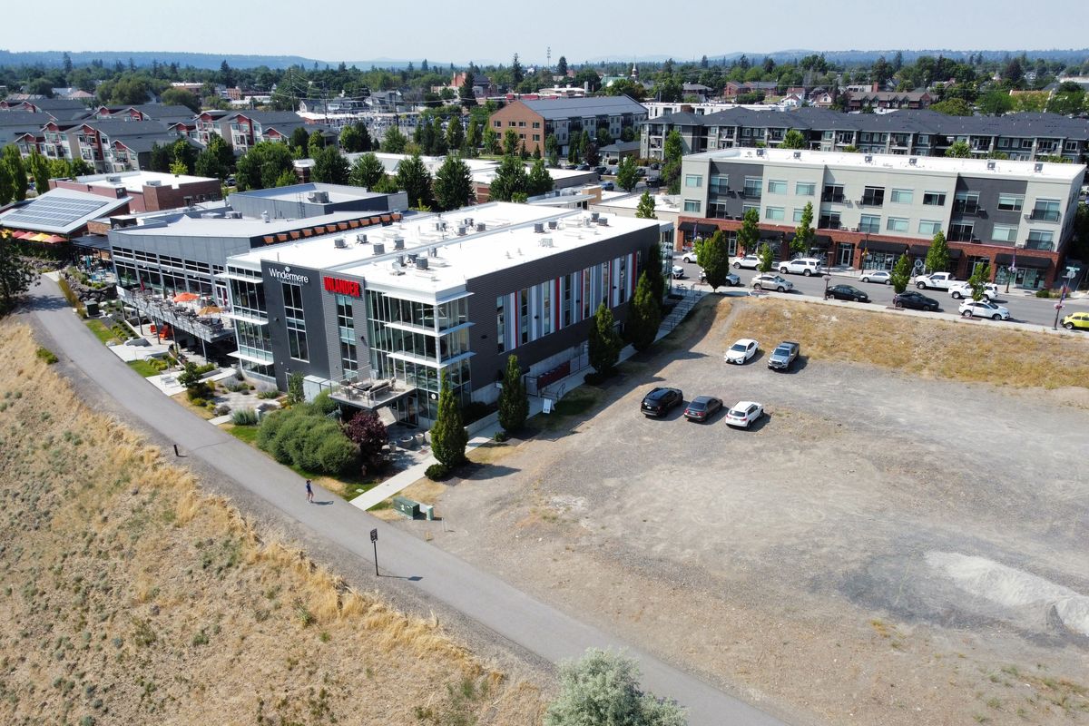 Greenstone is planning a new six-story multi-use retail/residential building on the empty land west of the Monroe Street bridge. The building would offer 200 residential units for residents aged 55 and older. (Jesse Tinsley/THE SPOKESMAN-REVIEW)