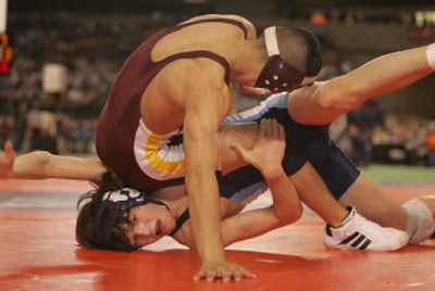 
Central Valley's Nick Cambron (bottom) beat Moses Lake's Roberto Cruz for the 4A 103-pound title. 
 (Robert Sumner Special to The Spokesman Review / The Spokesman-Review)