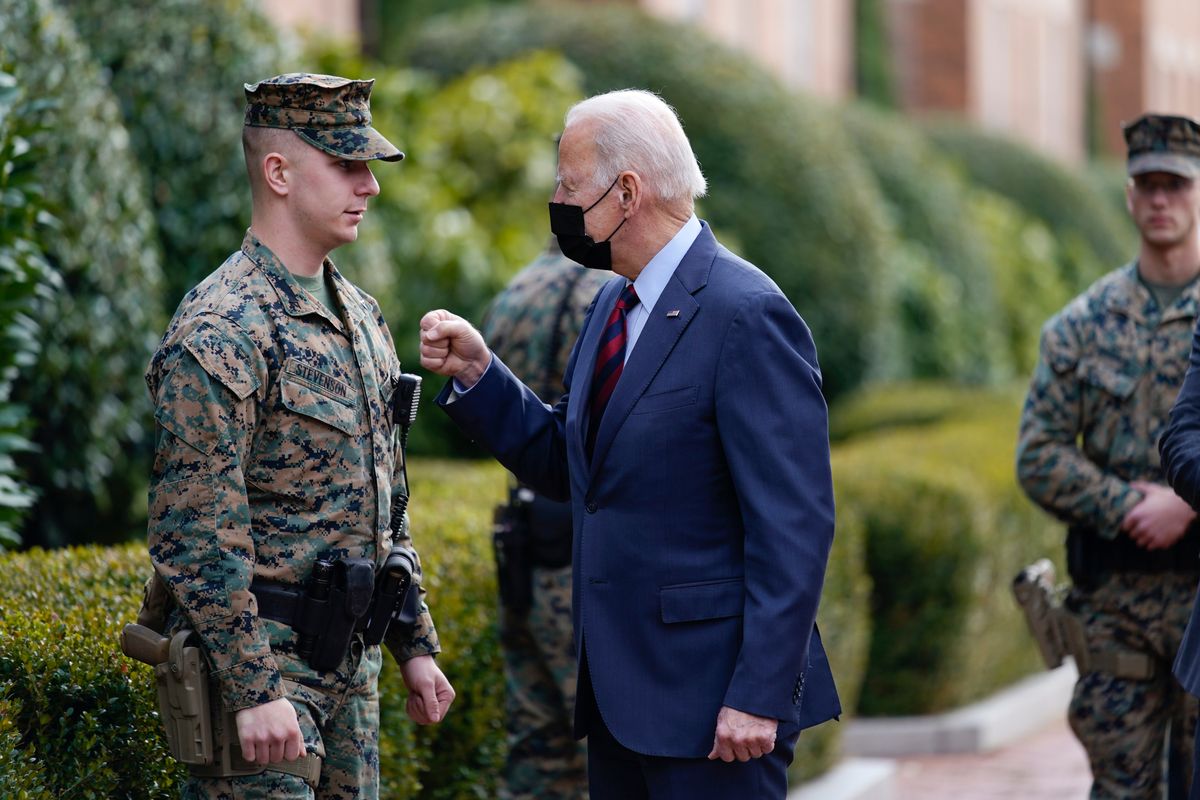 President Joe Biden visits a marine outside the Marine Barracks Washington, Tuesday, Jan. 25, 2022, in Washington.  (Andrew Harnik)