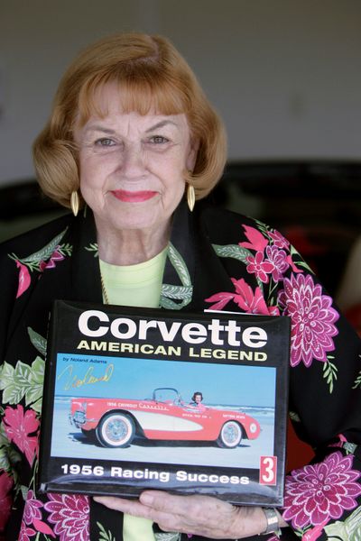 FILE - This July 17, 2008 file photo shows Betty Skelton Erde holding a book with a photo of her driving a 1956 Corvette pace car on the sand at Daytona Beach, Fla., at her home in The Villages, Fla. Erde, an auto racing pioneer who was once the fastest woman on Earth, died Aug. 31, 2011 in The Villages, the central Florida city where she lived with her husband, Allan Erde. She was 85. (John Raoux / Associated Press)