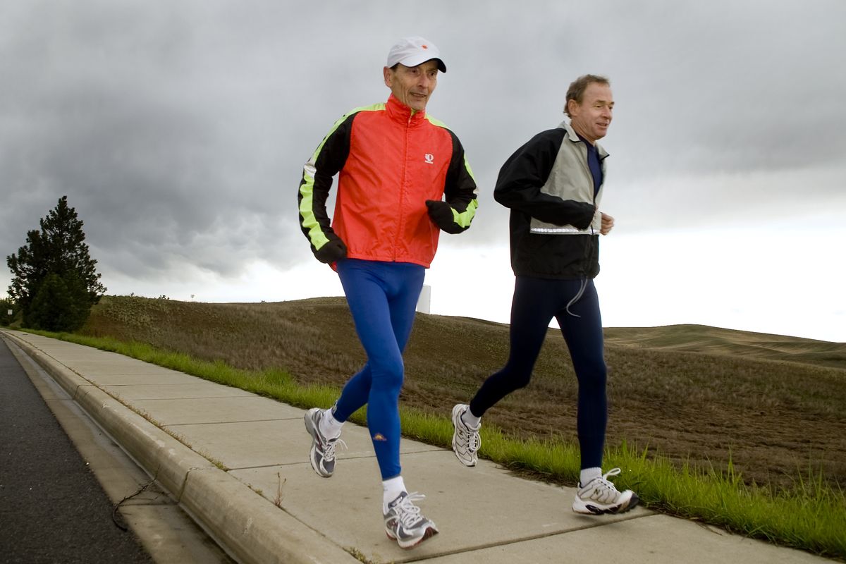 Eastern Washington University professors and Bloomsday runners Grant Smith, 72, left, and Scott Melville, 62,  train Tuesday  near Cheney.  (Colin Mulvany)