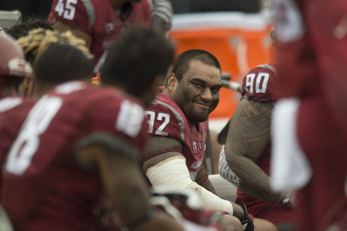 Washington State Cougars nose tackle Robert Barber (92) has something new to smile about after Whitman County Superior Court Judge David Fraizer granted a motion on Wednesday to allow Barber to continue college career with the Cougars. (Tyler Tjomsland / The Spokesman-Review)
