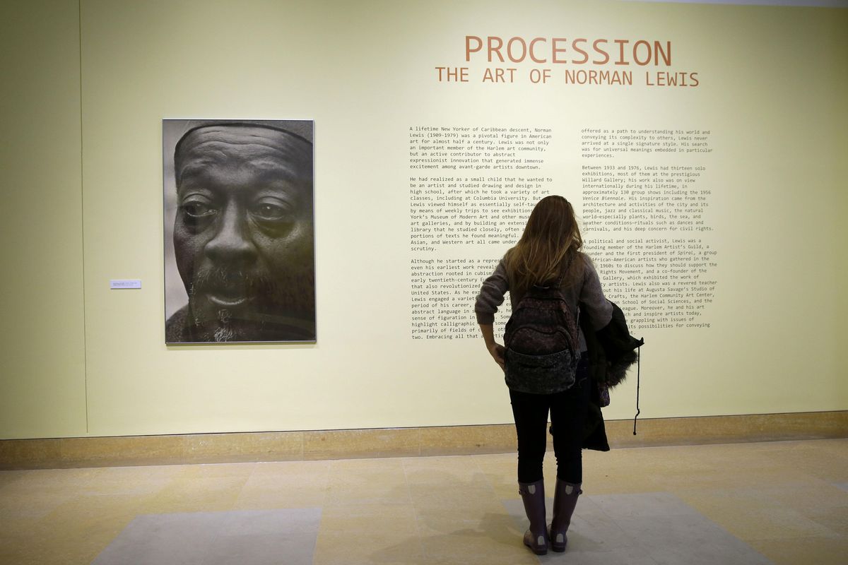 A woman views the exhibit titled, "Procession: The Art of Norman Lewis," Wednesday, Dec. 2, 2015, at the Pennsylvania Academy of the Fine Arts in Philadelphia. The show is scheduled to run through April 3, 2016. (AP Photo/Matt Rourke) ORG XMIT: PX201 (Matt Rourke / Associated Press)