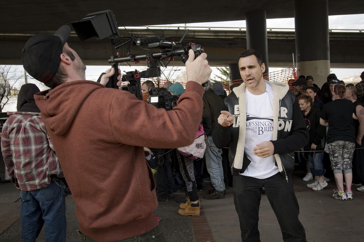 “Live Life Forward” TV show host Adrian Paul films an introduction to the No Poverty / Zero Hunger episode featuring Blessings Under the Bridge, an organization that serves dinner to the homeless under the freeway overpass at Fourth Avenue and  McClellan Street. The show will air May 30th on Lifetime Television. The actor, director and global humanitarian has been in front and behind the camera. He’s best known for his role as Duncan MacLeod, the title character in “Highlander: The Series.” (Colin Mulvany / The Spokesman-Review)