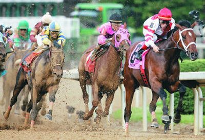 
Jockey Calvin Borel and Street Sense, left, make the turn as they continue a move from 19th place to first in the Kentucky Derby.
 (Associated Press / The Spokesman-Review)