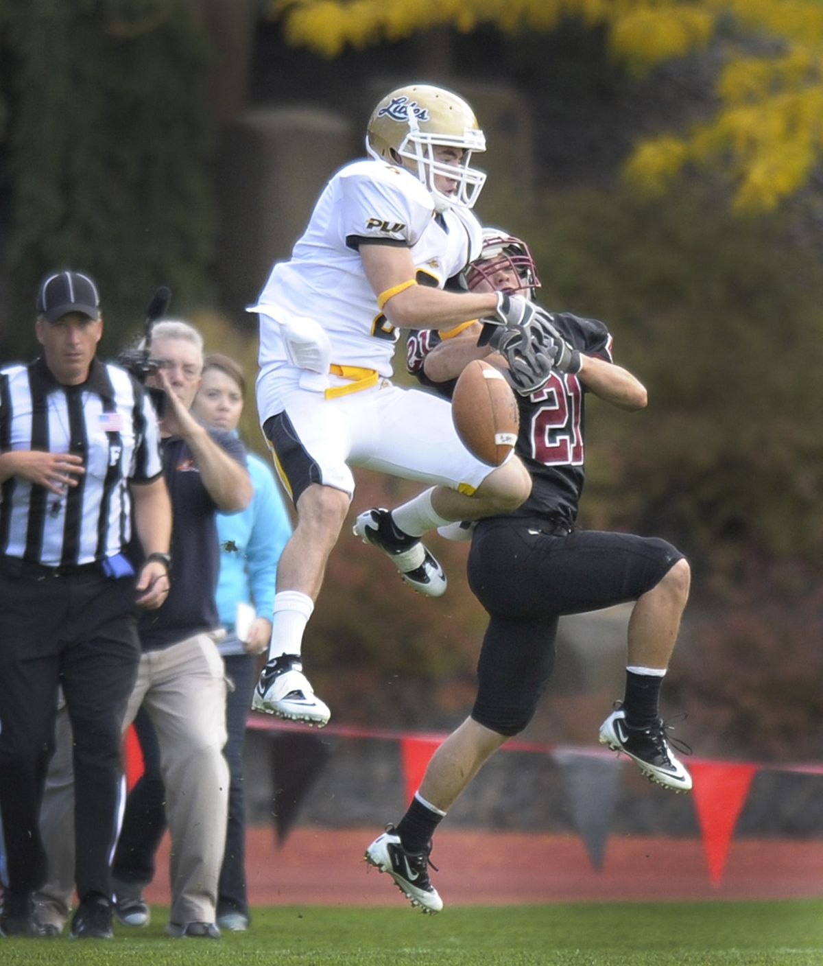 Whitworth University defensive back Paul Miller (21)  knocks away a first half PLU pass intended for Alex McDiarmid during the first half of their game at the Pine Bowl on the Whitworth campus, Saturday, Oct.  8, 2011. (Christopher Anderson / Spokesman-Review)